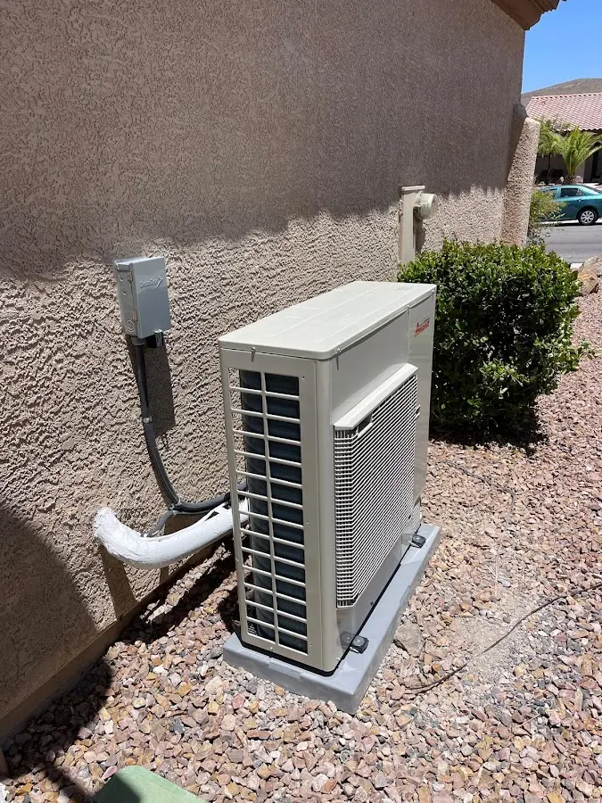 Residential air conditioning condenser unit in Fallon